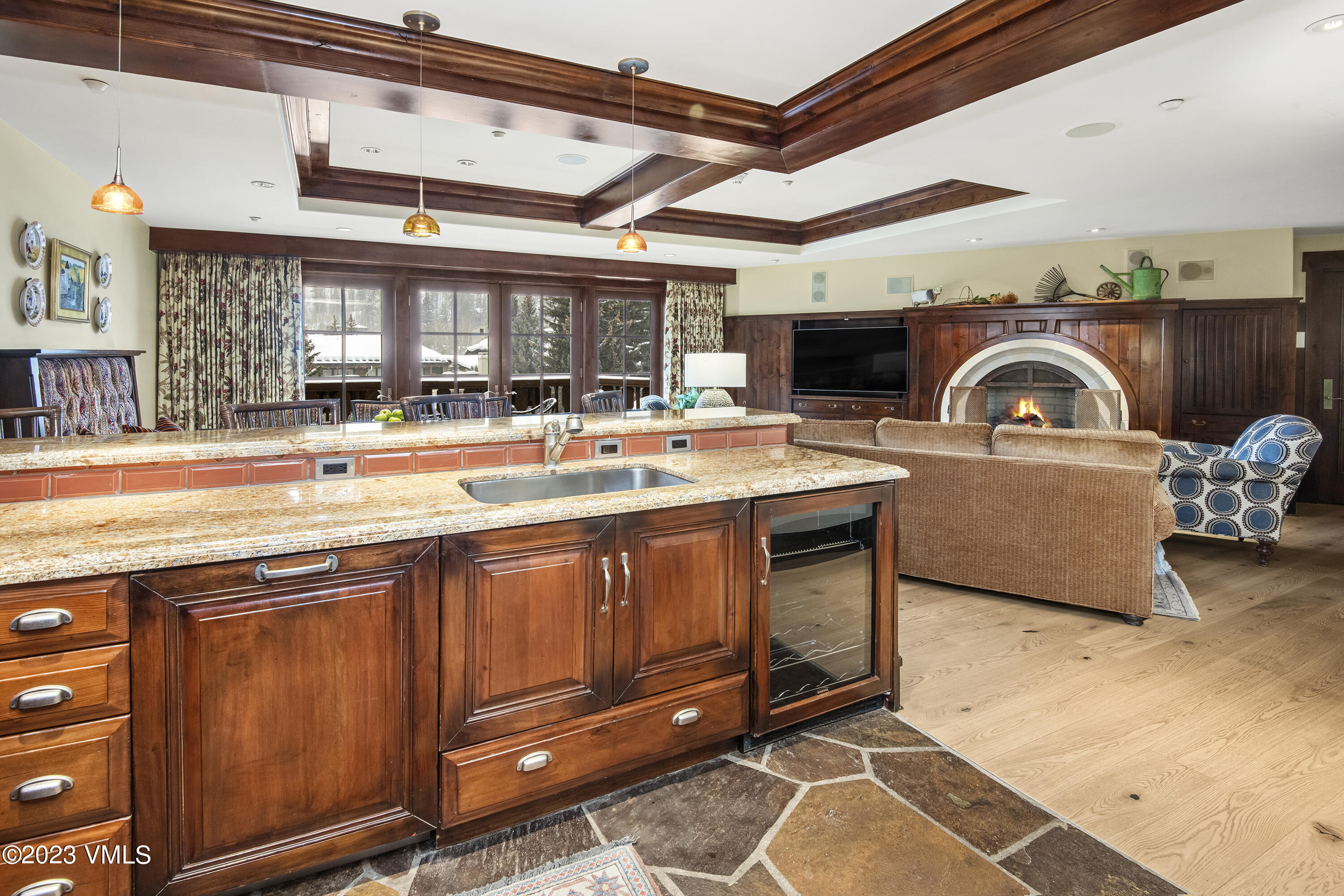1 Willow Bridge Road, Unit 31A Vail, CO 81657 - Photo 13 of 49 a living room with furniture a flat screen tv and kitchen view
