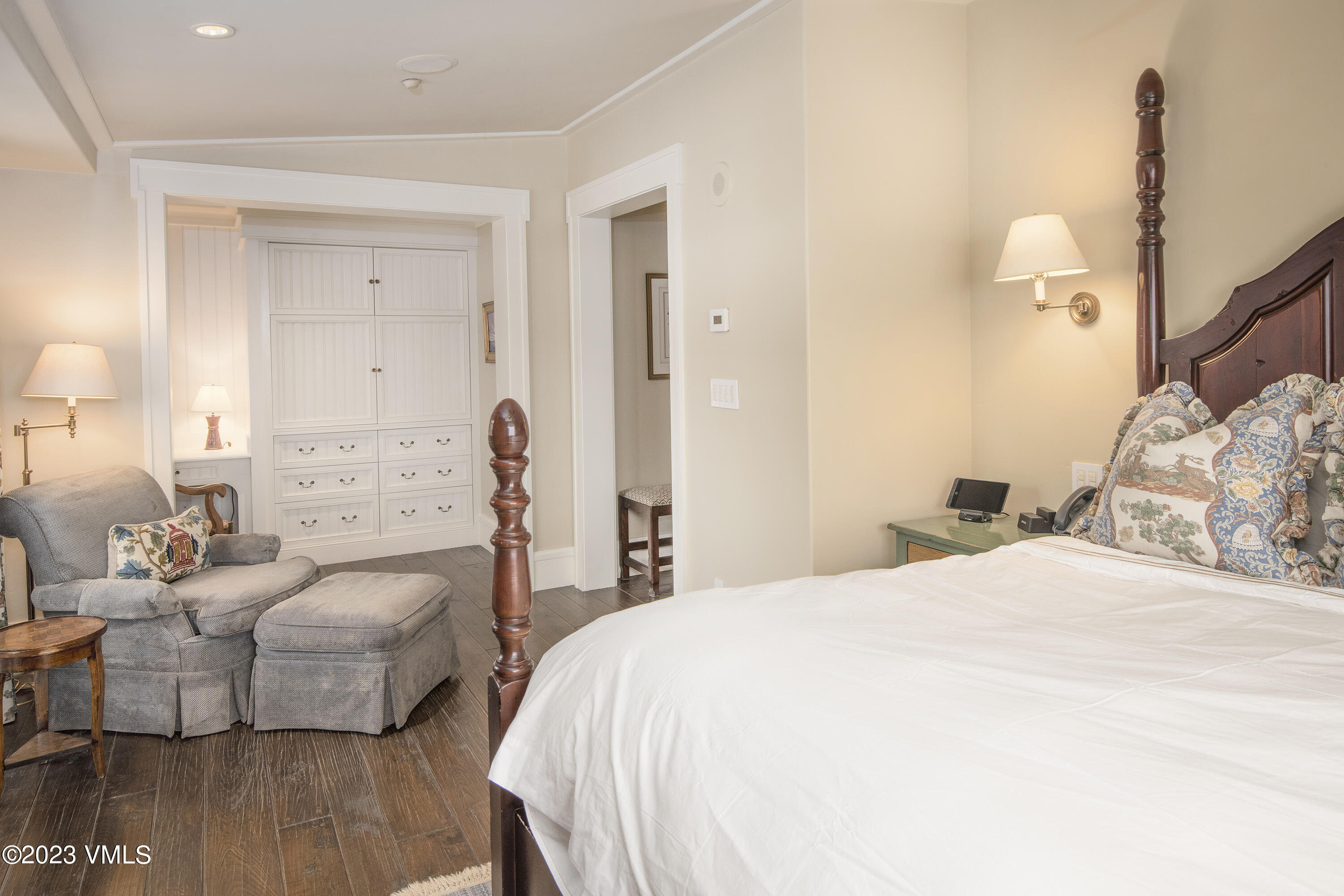 1 Willow Bridge Road, Unit 31A Vail, CO 81657 - Photo 24 of 49 a bedroom with a bed and wooden floor