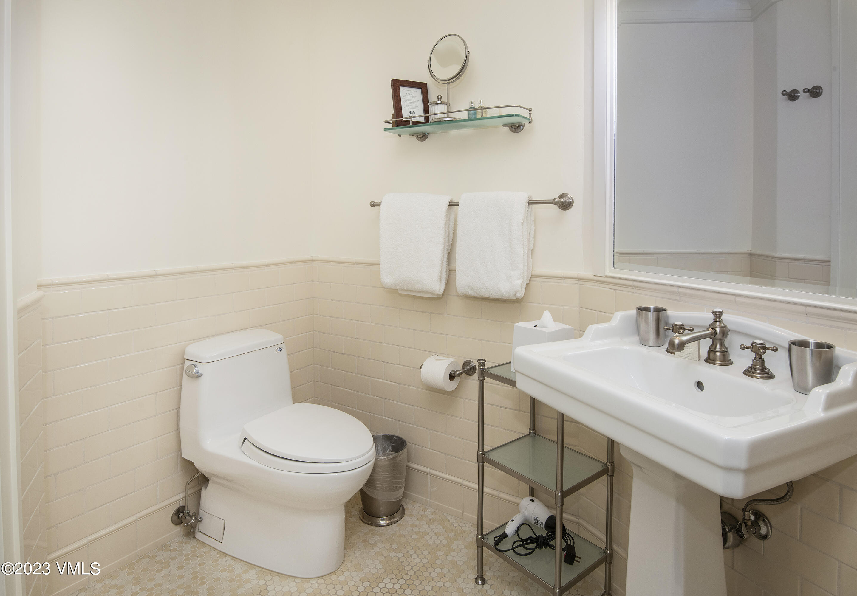 1 Willow Bridge Road, Unit 31A Vail, CO 81657 - Photo 31 of 49 a bathroom with a sink a toilet and a mirror