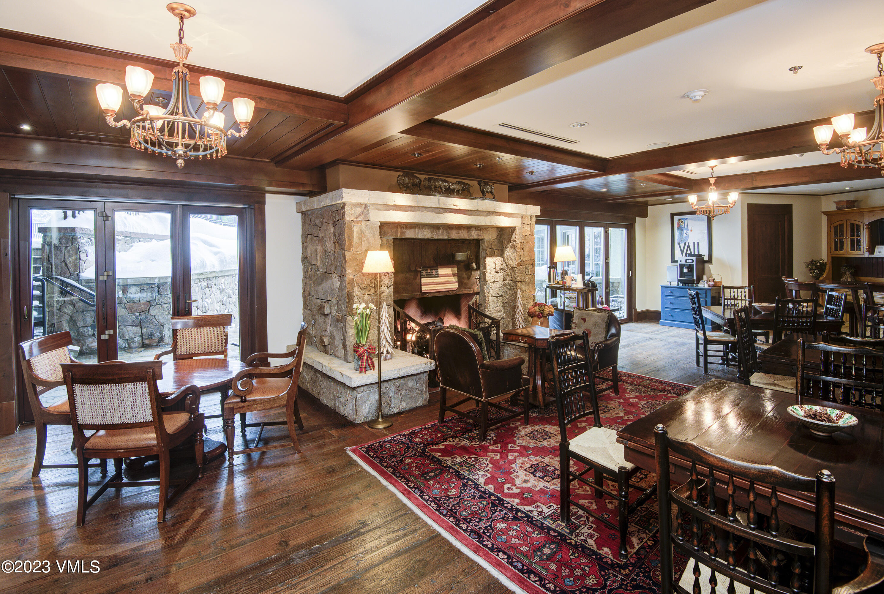 1 Willow Bridge Road, Unit 31A Vail, CO 81657 - Photo 35 of 49 a living room with lots of furniture chandelier and large windows