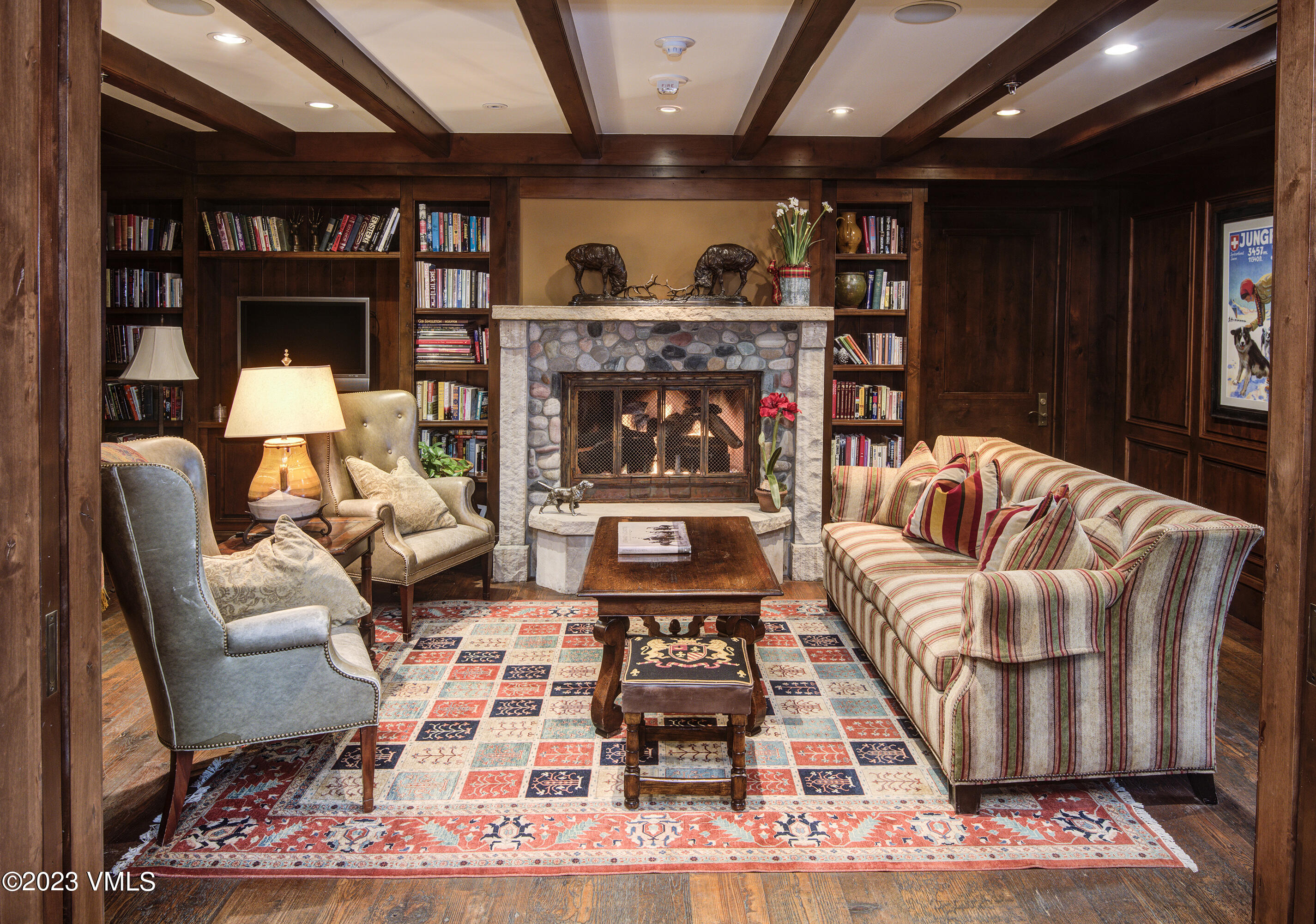 1 Willow Bridge Road, Unit 31A Vail, CO 81657 - Photo 36 of 49 a living room with furniture a fireplace and a flat screen tv
