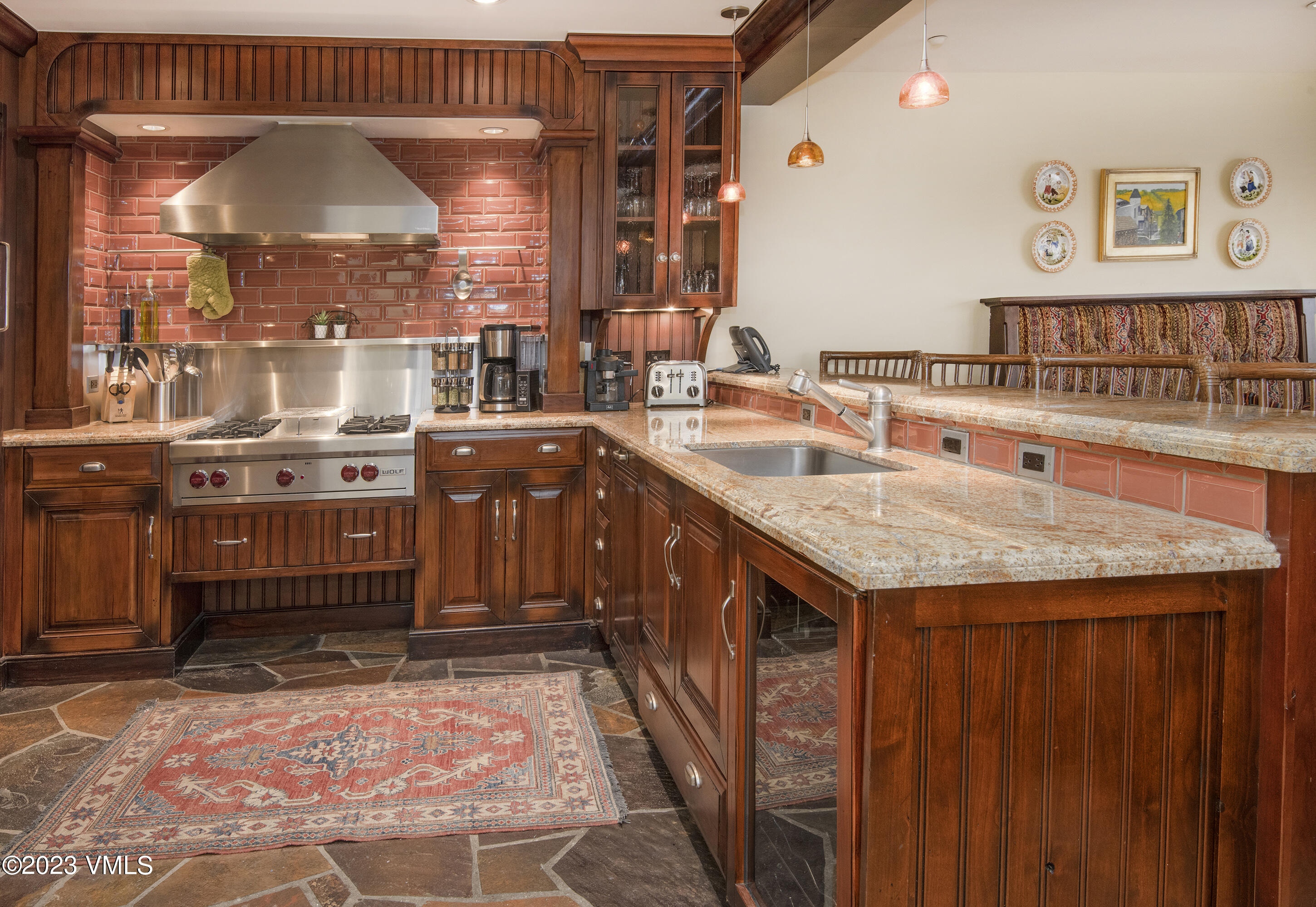 1 Willow Bridge Road, Unit 31A Vail, CO 81657 - Photo 9 of 49 a kitchen with stainless steel appliances granite countertop a sink and a stove