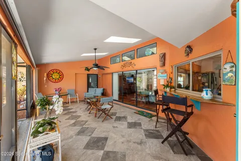 a kitchen with stainless steel appliances granite countertop a sink and a refrigerator