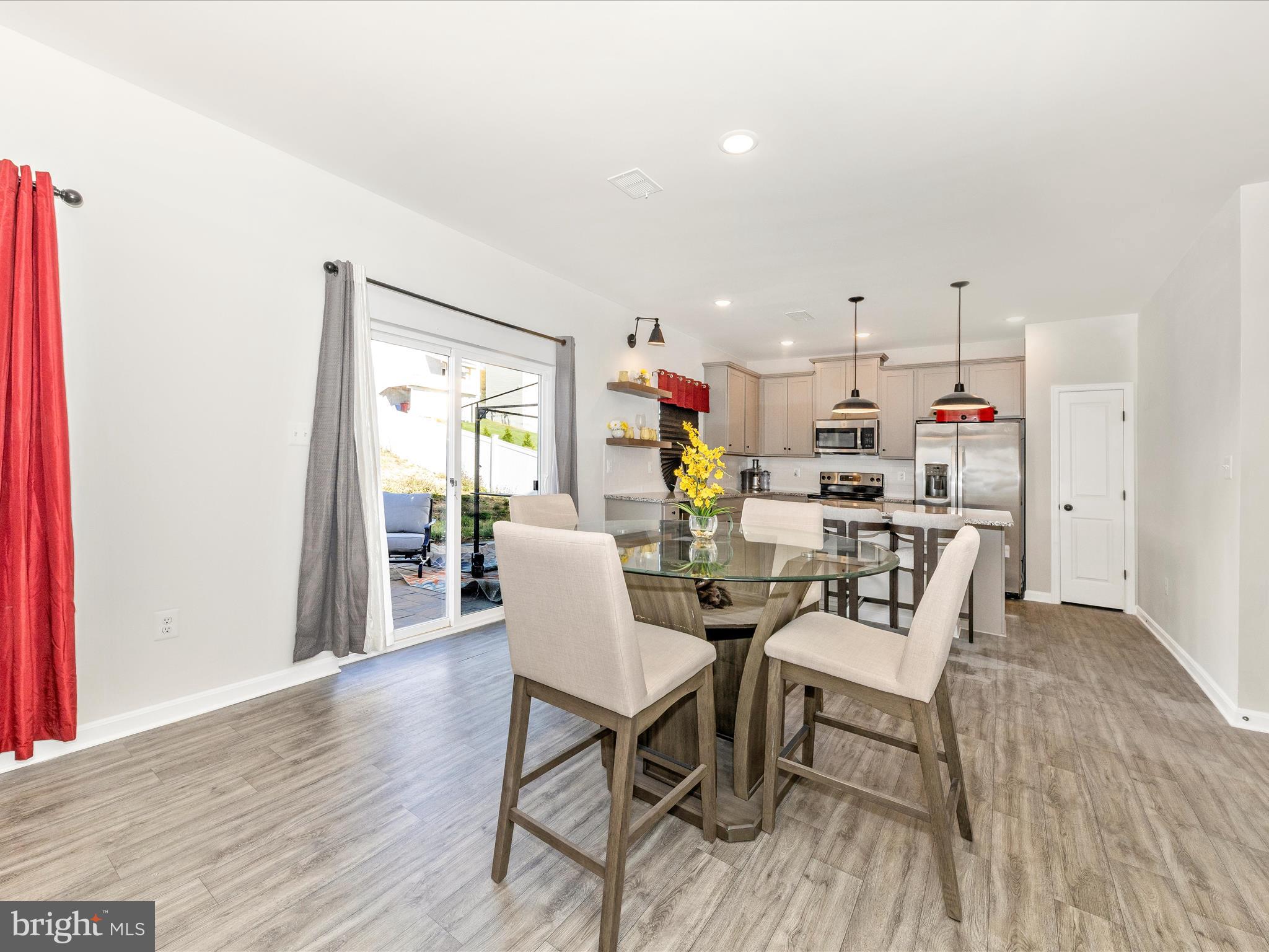 76 Diving Scaup Road Hedgesville, WV 25427 - Photo 11 of 41 a view of a dining room with furniture and wooden floor