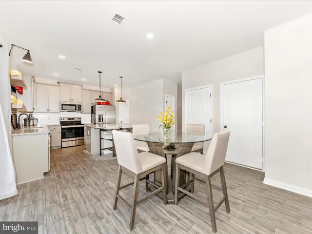 a view of kitchen with cabinets and wooden floor