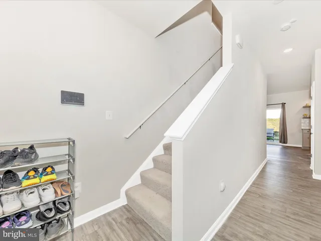 a view of an entryway with wooden floor