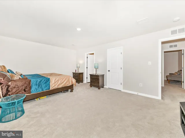 an empty room with furniture and natural light