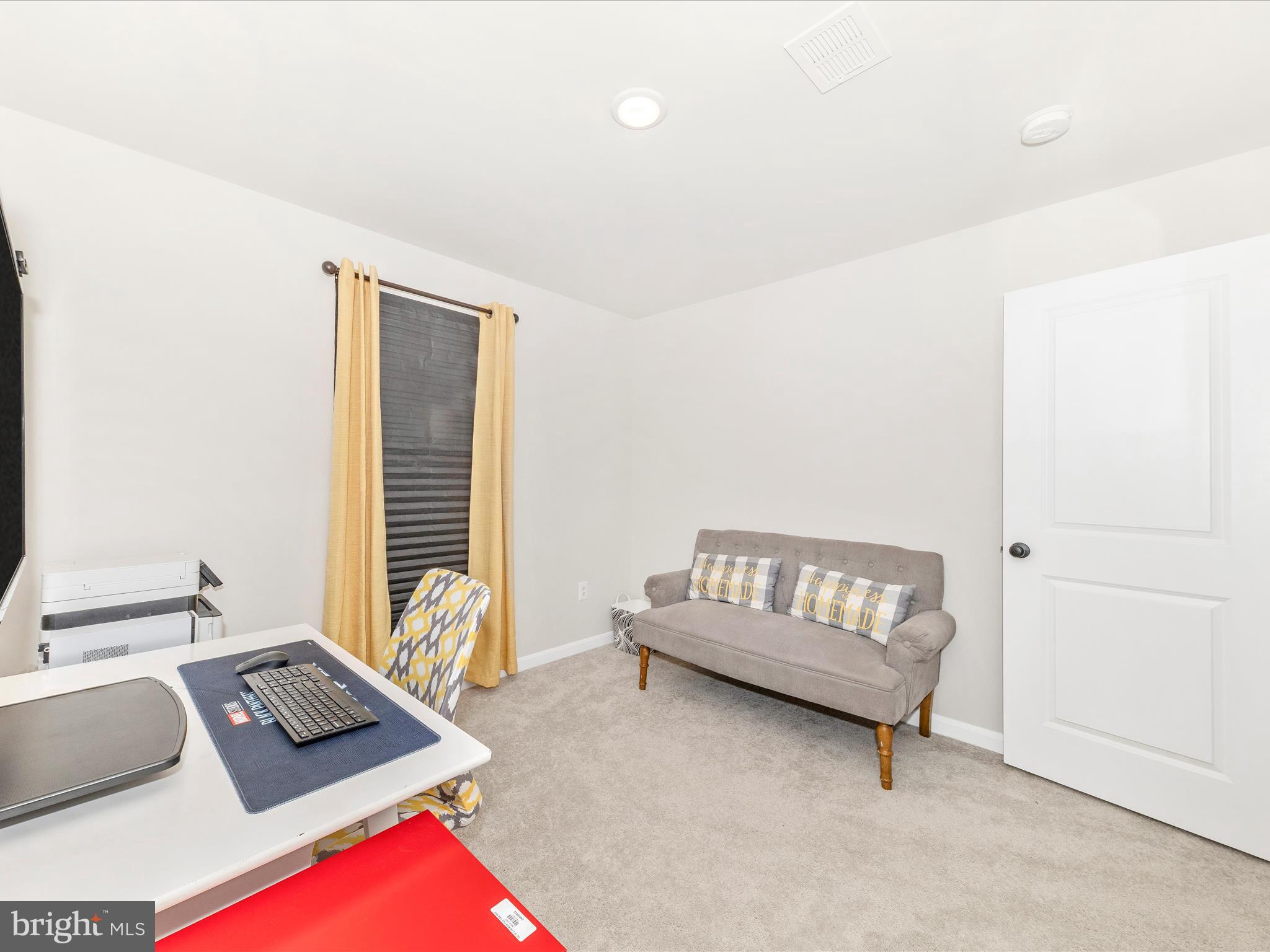 76 Diving Scaup Road Hedgesville, WV 25427 - Photo 29 of 41 a bedroom with furniture and a window