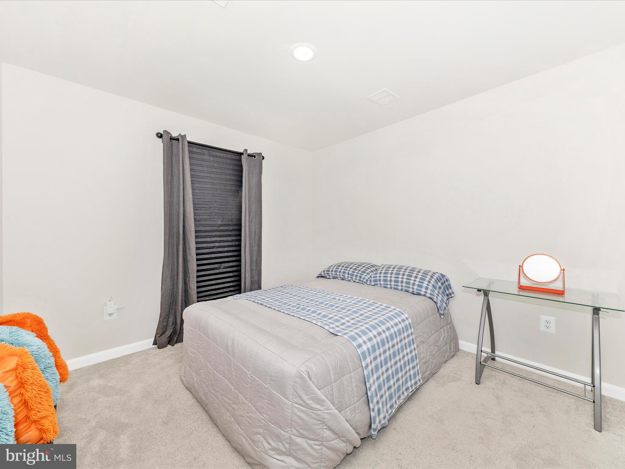 76 Diving Scaup Road Hedgesville, WV 25427 - Photo 30 of 41 a bedroom with a bed and dresser