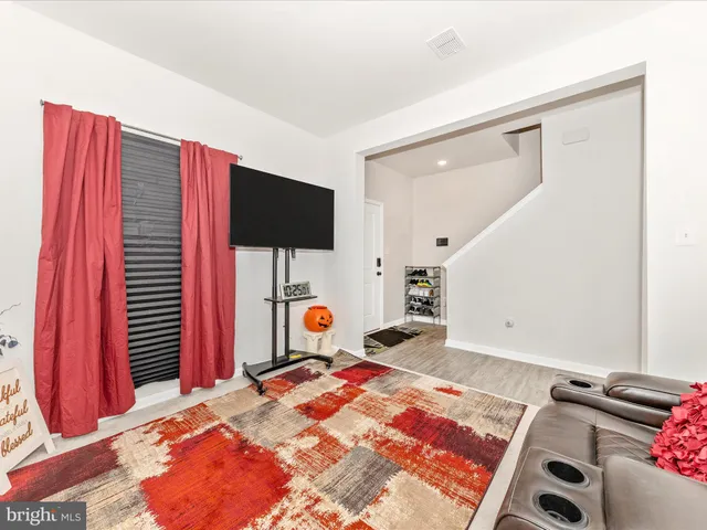 a bedroom with a bed and a television