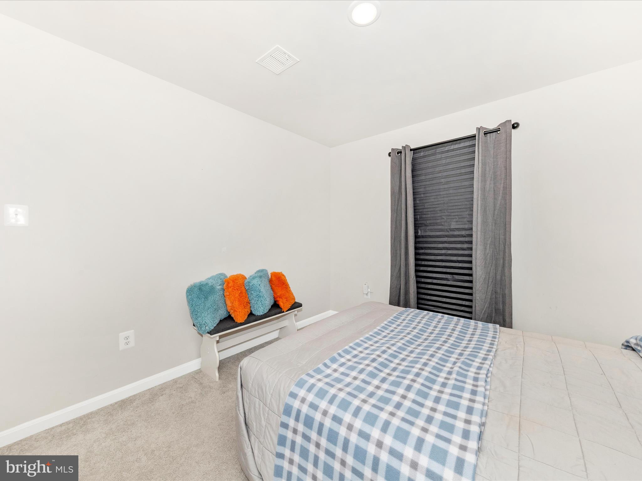 76 Diving Scaup Road Hedgesville, WV 25427 - Photo 31 of 41 a bedroom with a bed and a window