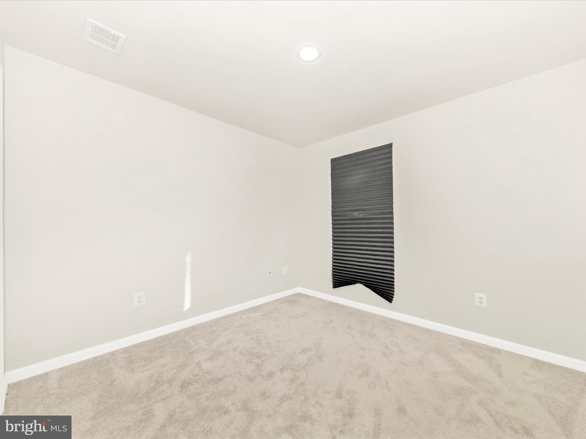 76 Diving Scaup Road Hedgesville, WV 25427 - Photo 32 of 41 a view of an empty room with a window