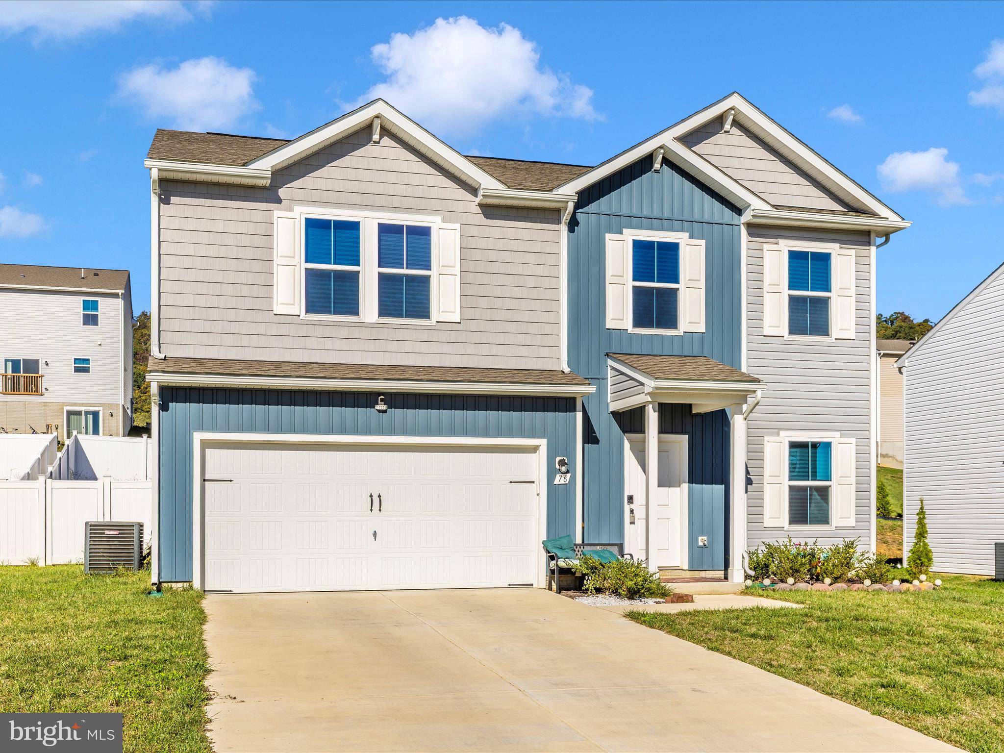 76 Diving Scaup Road Hedgesville, WV 25427 - Photo 36 of 41 a front view of a house with a yard and garage