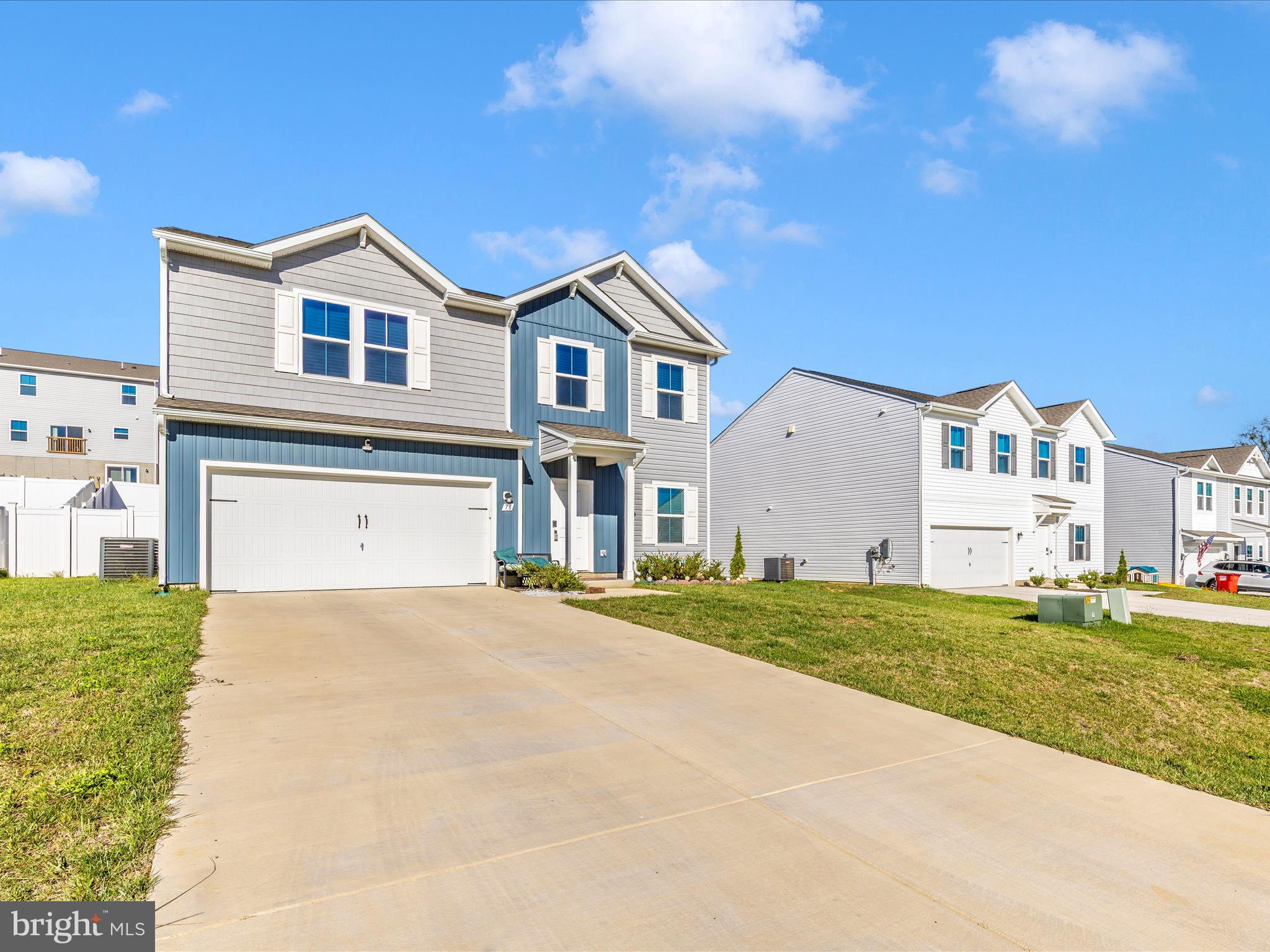 76 Diving Scaup Road Hedgesville, WV 25427 - Photo 38 of 41 a view of a house with a yard and garage