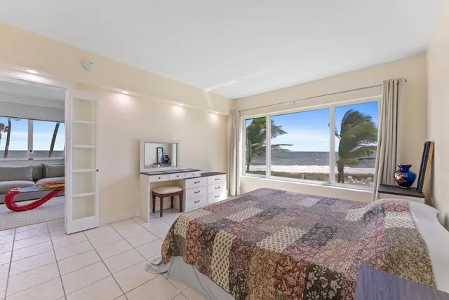 a kitchen with stainless steel appliances a refrigerator and a stove top oven