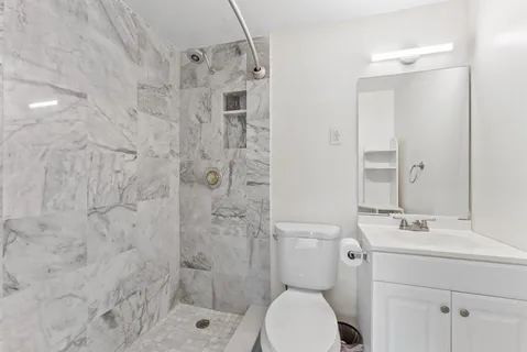 a view of kitchen with furniture and chandelier