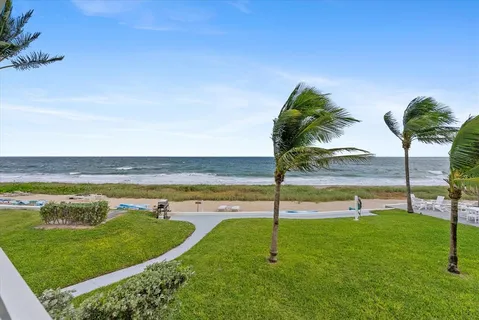 an outdoor space with furniture and garden view