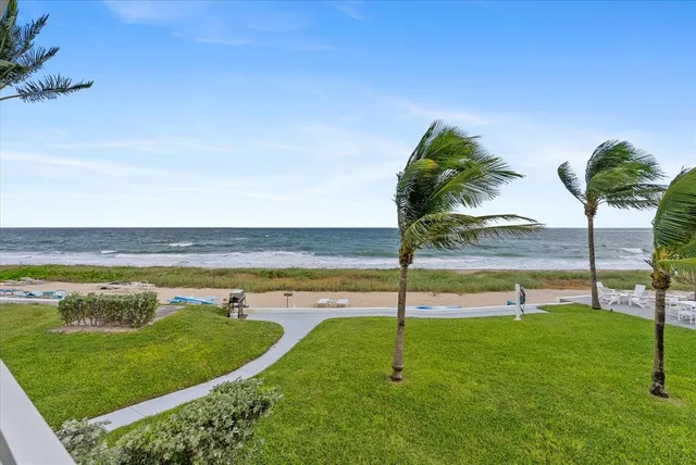 an outdoor space with furniture and garden view