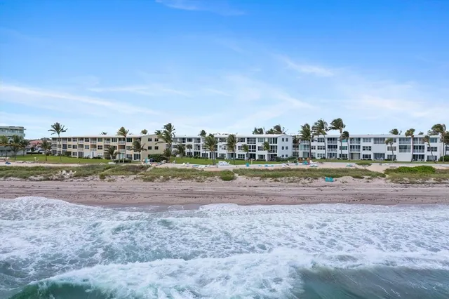 an aerial view of a city with beach