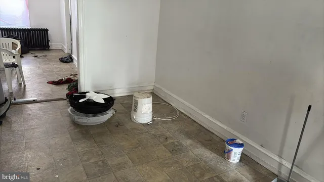 a living room with furniture a window and a flat screen tv