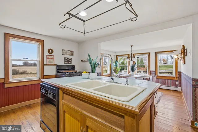 a kitchen with stainless steel appliances granite countertop a stove and a refrigerator