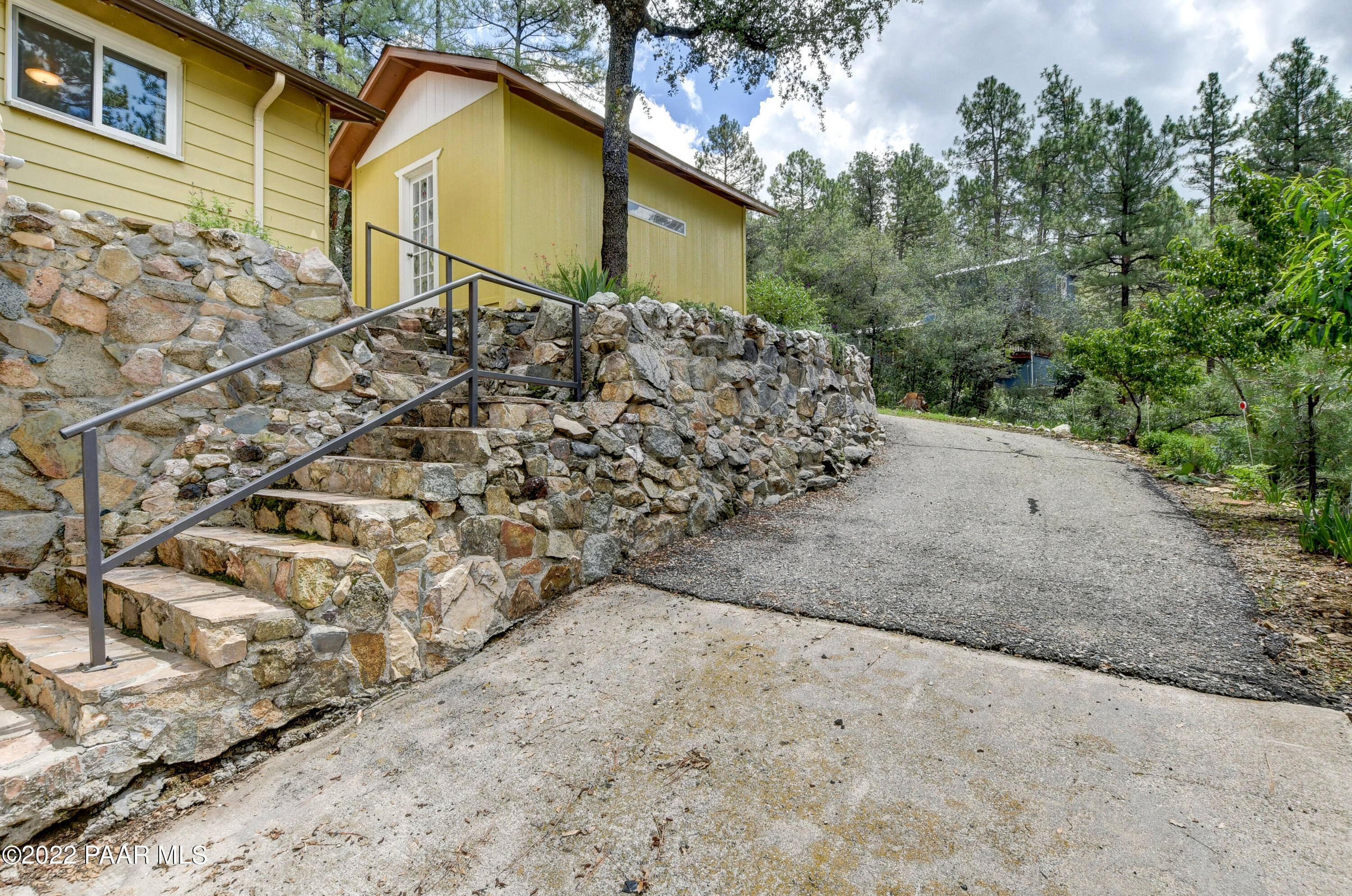 4939 South Kaibab Road Prescott, AZ 86303 - Photo 45 of 56 Right side drive rock wall