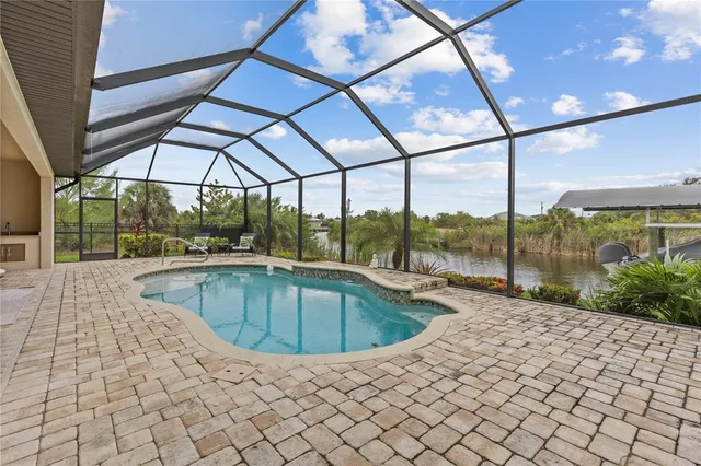 a view of outdoor space with swimming pool and furniture