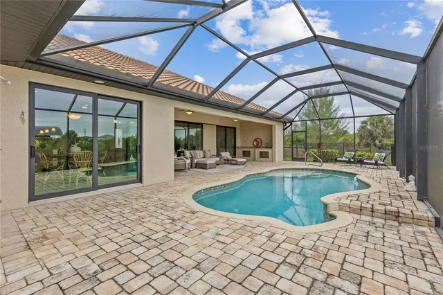 a view of a swimming pool with a patio