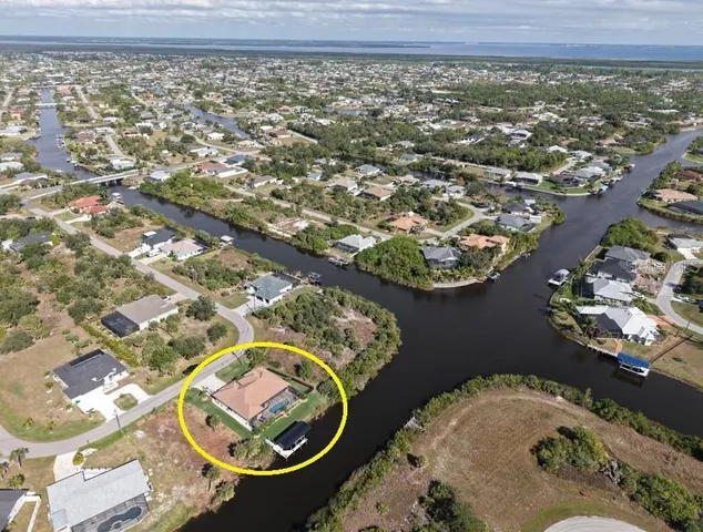an aerial view of a swimming pool and outdoor space