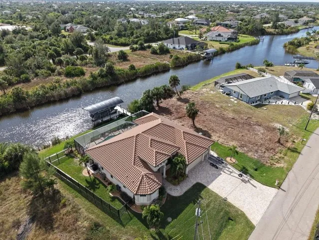 an aerial view of a house with outdoor space