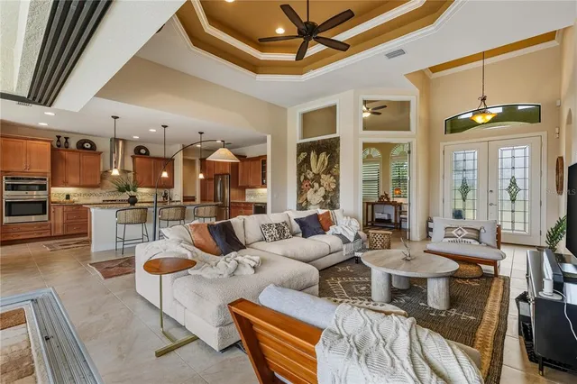 a living room with lots of furniture and a chandelier