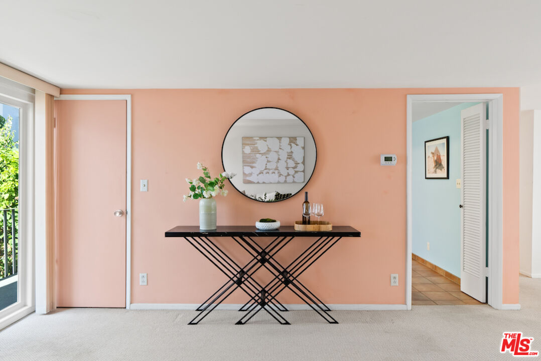 852 21st Street, Unit E Santa Monica, CA 90403 - Photo 3 of 20 a view of a hallway with paintings on the wall