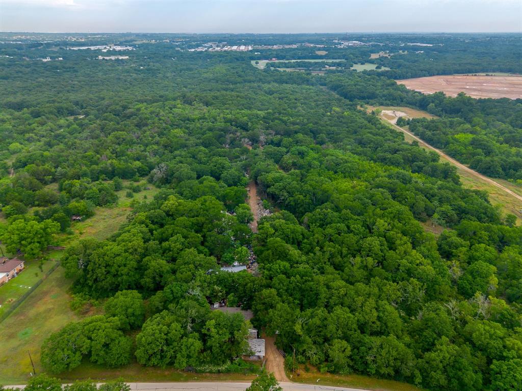 8635 Retta Mansfield Road Mansfield, TX 76063 - Photo 5 of 11 an aerial view of residential houses with outdoor space and trees