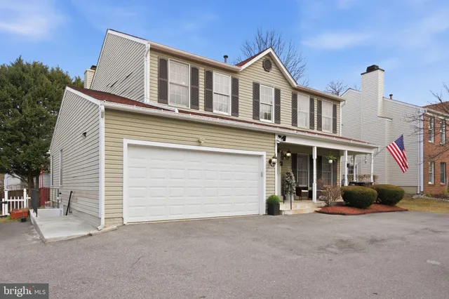 a view of a house with a backyard and porch