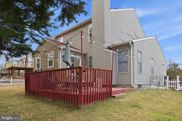 a view of a house with wooden fence