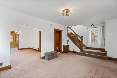 a view of an empty room with stairs
