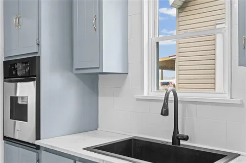 a kitchen with a sink and cabinets