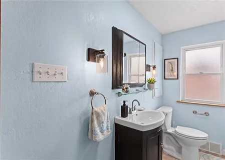 a bathroom with a sink and a toilet