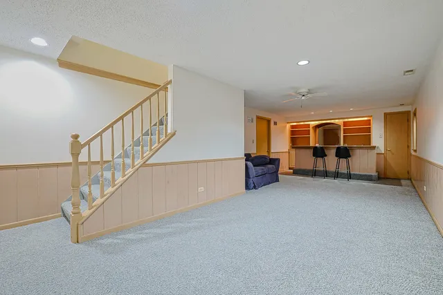 a view of an empty room with stairs