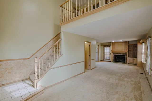a view of an entryway with fireplace