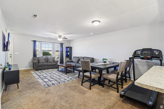 1077 South 1850th Street West Springville, UT 84663 - Photo 7 of 22 Carpeted dining space featuring ceiling fan and a textured ceiling