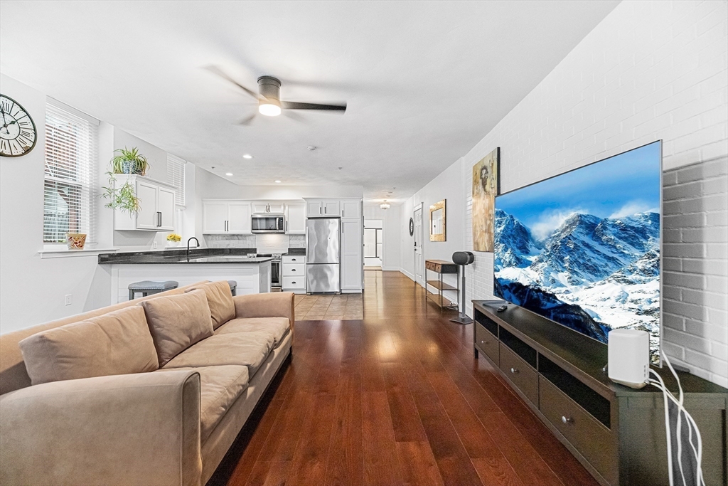 52-58 Washington Street, Unit BC Haverhill, MA 01832 - Photo 2 of 23 a living room with furniture and kitchen view