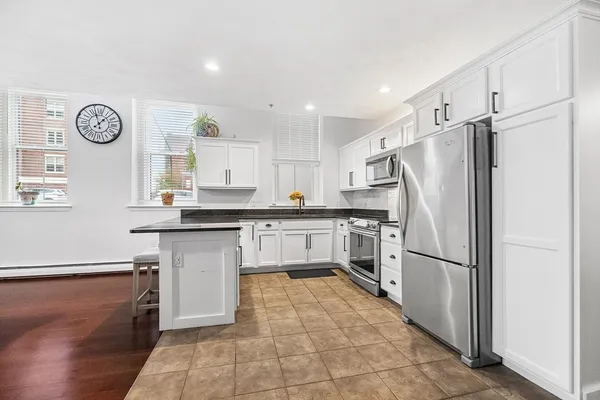 a kitchen with refrigerator cabinets and a counter top space