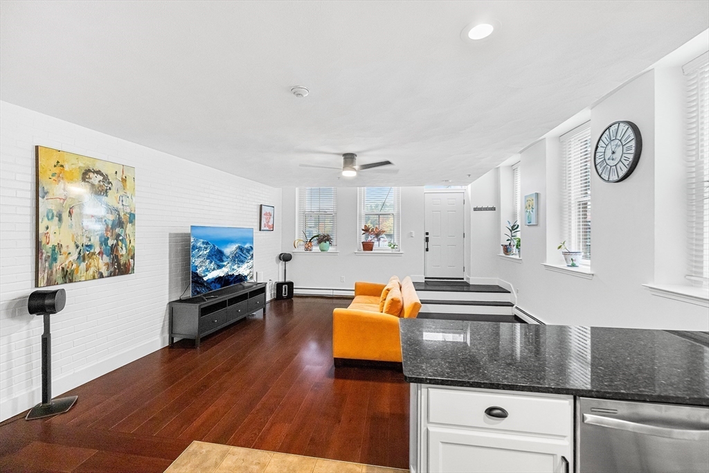 52-58 Washington Street, Unit BC Haverhill, MA 01832 - Photo 6 of 23 a living room with furniture and wooden floor