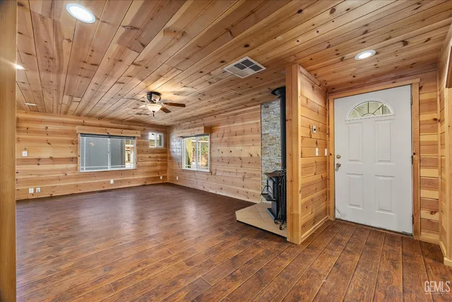 a view of a room with wooden floors