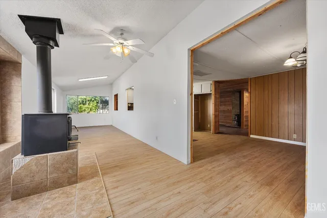 a bathroom with a granite countertop sink a toilet and a mirror