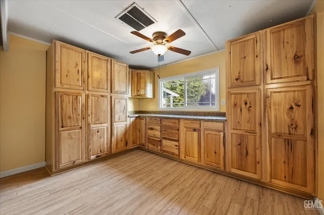 a blue umbrella sitting in front of a house
