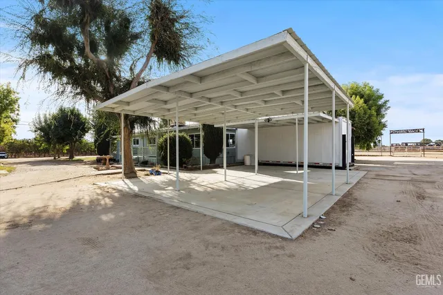 a view of a house with wooden fence