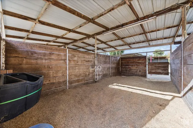 a view of parking space with wooden fence
