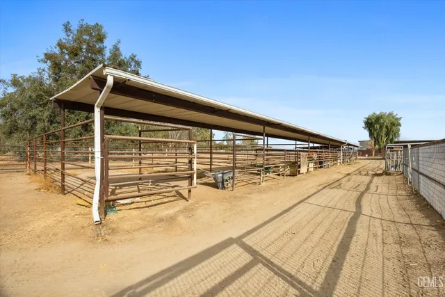 a view of a lake with boats and trees in the background